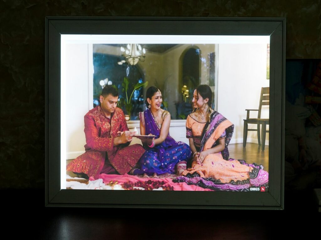 Backlit photo frame with a picture of 3 people.