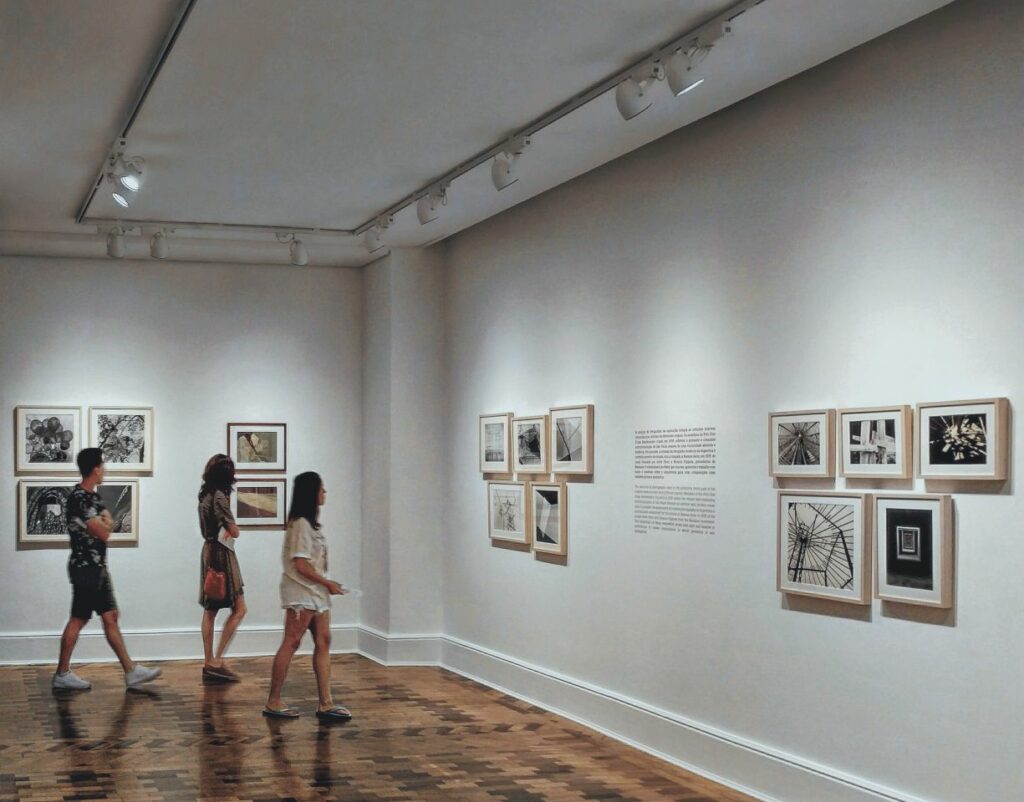 people looking at photos in an exhibition